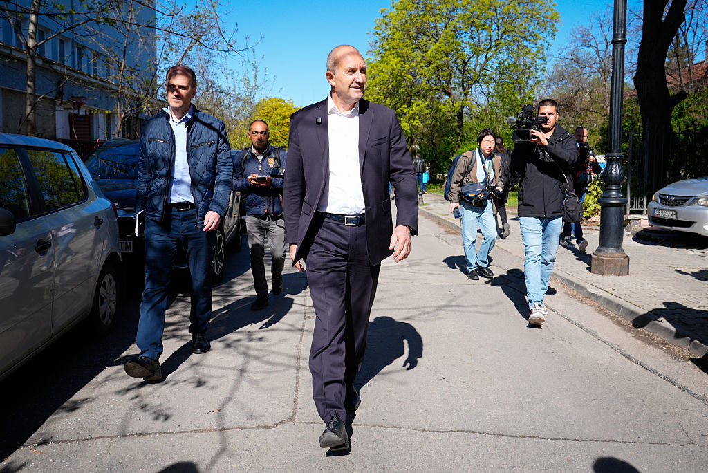 Former Bulgarian President Rumen Radev is followed by members of the media after voting in Sofia, Bulgaria, April 19, 2026