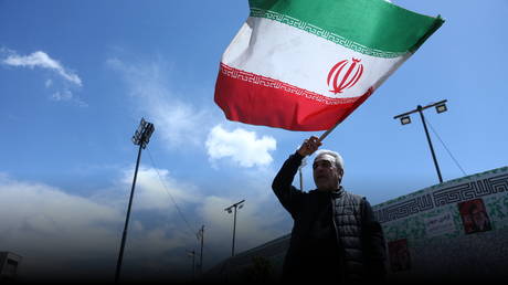 A man attends a rally in Tehran, Iran, April 8, 2026.