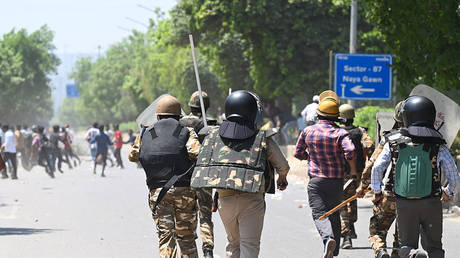 Wage hike protests turn violent in India