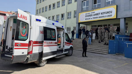 Turkish security forces and emergency staff stand at the courtyard of a high school where an assailant opened fire, in Siverek, Türkiye, April 14, 2026.