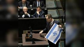 MP brandishes Israeli flag with swastika in Polish parliament (VIDEO)