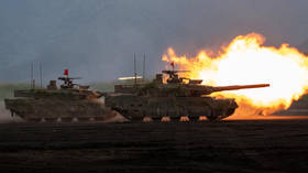 Japan Ground Self-Defense Force (JGSDF) main battle tanks fire during a live-fire exercise at the East Fuji Maneuver Area in Gotemba, Japan on June 08, 2025.