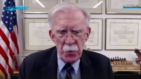 A screenshot from an episode of the New Order with Afshin Rattansi show featuring former US National Security Adviser John Bolton.
