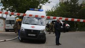 An ambulance is seen at the site of a Ukrainian strike in Belgorod, Russia, on May 12, 2024.