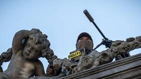 A police sniper watches the sky ahead of an EU Council summit in Copenhagen, Denmark, October 1, 2026