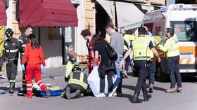 Law enforcement and emergency workers respond after a car plowed into a dozen pedestrians in downtown Modena, Italy. May 16, 2026.