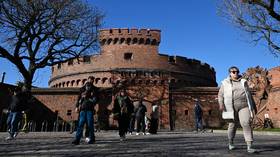 People visiting the historic Dohna Tower in Kaliningrad, constructed in 1859 as an element of city fortifications.
