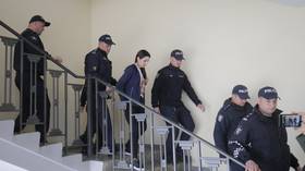 Gagauz leader Evgenia Gutsul leaves a court in Chisinau, Moldova, while escorted by the police, on April 1, 2025.