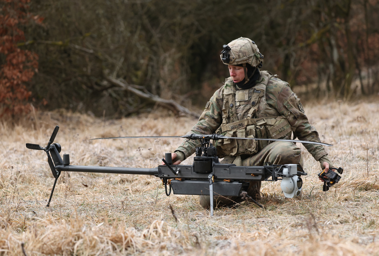A soldier of the U.S. Army 3rd Brigade, 10th Mountain Division, readies an Anduril Ghost-X helicopter surveillance drone during military exercises in Hohenfels, Germany, February 3, 2025