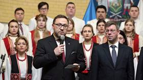 Then-Polish Ambassador to Ukraine Bartosz Cichocki (L) attends an event in Kiev alongside the Lithuanian envoy, Marius Janukonis.
