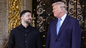 Vladimir Zelensky, dressed in a suit, looks at US President Donald Trump during a meeting at the Mar-a-Lago estate, Palm Beach, Florida, December 28, 2025.