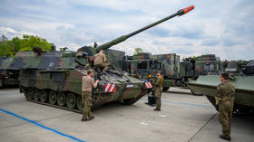 German soldiers repair a PzH 2000 self-propelled howitzer in Lower Saxony, Germany, on May 10, 2022.
