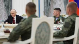 President Vladimir Putin holds a meeting at the Kremlin with participants in the Ukraine conflict