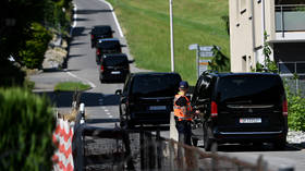 Vehicles move along a road leading to a hotel complex in Burgenstock near Lucerne, Switzerland, June 20, 2026.