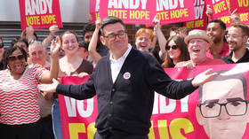 Andy Burnham greets supporters at the Labour Party campaign HQ in Ashton-in-Makerfield, England, June 18, 2026