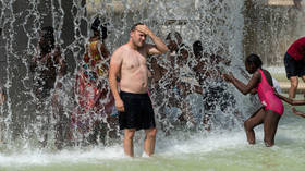 A man bathes in the Trocadero fountain amid a heatwave in Paris, France, July 25, 2019