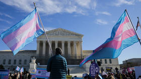 Pro-trans activists protest outside the US Supreme Court in Washington DC, January 13, 2026