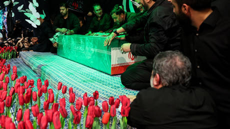 People gather around the body of Ayatollah Ali Khamenei in Tehran, July 2, 2026