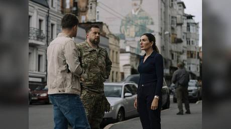 MAGA influencer denies Ukraine ties, interviews neo‑Nazi.
