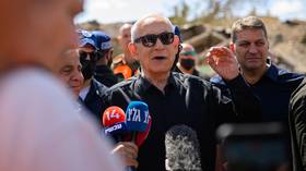 Israeli Prime Minister Benjamin Netanyahu visiting the area of an Iranian missile strike in Dimona in March 2026.