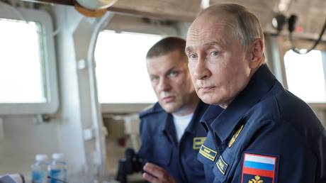 Russian President Vladimir Putin visits the Guards missile cruiser Varyag during the final stage of the Pacific Fleet's exercises off the coast of Sakhalin region, Russia.
