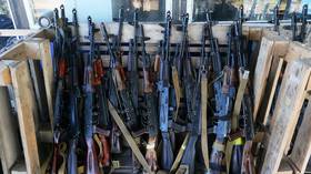 A stash of AK-47 assault rifles used during the training of Ukrainian women in 2023.
