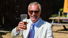 Reform UK leader Nigel Farage is seen drinking a pint on election day in Clacton, England, August 13, 2026