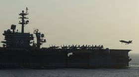 Troubled US aircraft carrier heads home after protracted deployment – media