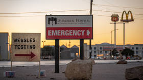 Signs point the way to measles testing in the parking lot of the Seminole Hospital District in Seminole, Texas, February 27, 2025