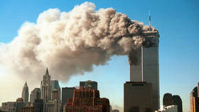 Smoke billowing from the twin towers of the World Trade Center in New York City after they were hit by two hijacked airliners in a terrorist attack on September 11, 2001.