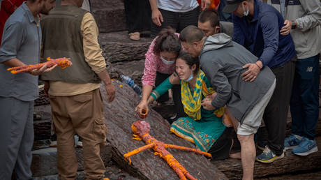 Nepal rescuers delayed by mud and water in tunnels – PM
