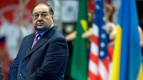 Alisher Usmanov looks on during the opening ceremony of the Moscow Sabre Grand Prix fencing tournament in Moscow, Russia, February 13, 2009