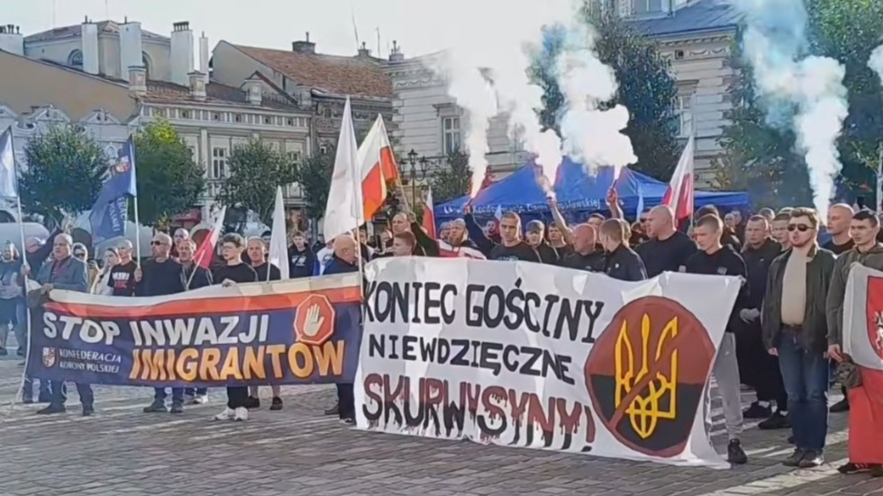 ‘Bandera, get out!’ Protesters demand migration crackdown after Ukrainian kills Polish priest (VIDEO)