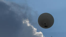 A weather balloon of the German Weather Service (DWD) climbs into the sky near Lindenberg, Germany, on August 2, 2019.