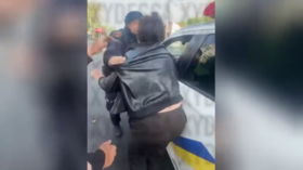 Ukrainian police choke woman unconscious (VIDEO)