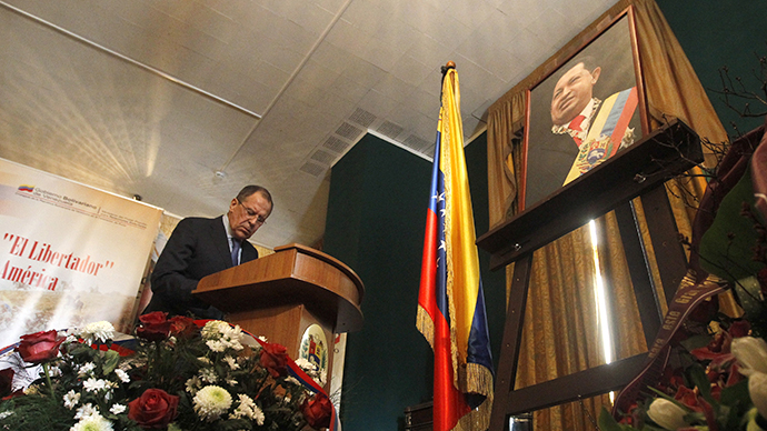 Russia's Foreign Minister Sergei Lavrov writes a condolence book as he visits the Venezuelan embassy to pay his tribute to the late Hugo Chavez in Moscow, March 6, 2013. (Reuters / Maxim Shemetov)