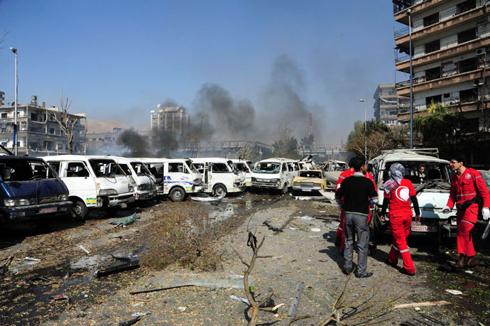 Damaged vehicles and the Russian embassy building (rear C) are seen after an explosion in central Damascus February 21, 2013.(Reuters / Sana)
