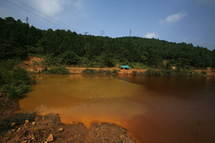 A contaminated lake is seen near Dabaoshan in the northern part of China's Guangdong province. (Reuters / Bobby Yip)