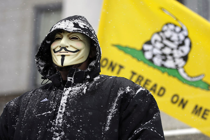 An activist wears a Guy Fawkes mask at a pro-gun rally as part of the National Day of Resistance, at the state Capitol in Salt Lake City, Utah, February 23, 2013. (Reuters/Jim Urquhart)