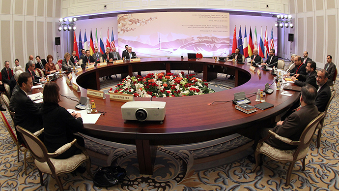 World powers and Iran's representatives sit at a table during talks on Iran's nuclear programme in the Kazakh city of Almaty on February 26, 2013. (AFP Photo / Stanislav Filippov))