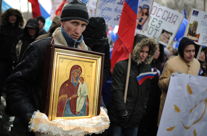 People march during a rally in defence of Russian children in Moscow, March 2, 2013. (RIA Novosti / Ramil Sitdikov)