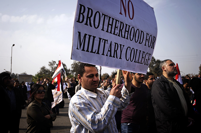 An Egyptian protester holds a sign during a demonstration against the Muslim Brotherhood in Cairo on March 1, 2013. (AFP Photo / Gianluigi Guercia)