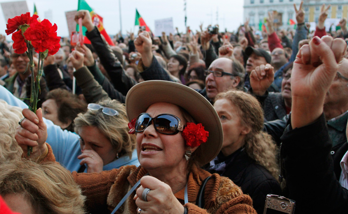 People shout slogans as they take part in a protest against government austerity policies at Lisbon's main square Praca do Comercio March 2, 2013 (Reuters / Hugo Correia)