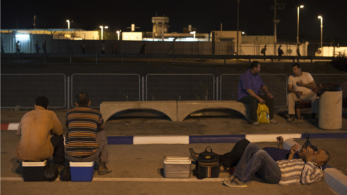 Palestinian labourers wait for work after crossing through Israel's Eyal checkpoint from the West Bank town of Qalqilya (Reuters/Nir Elia)