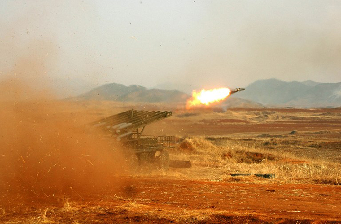 This undated photo released by North Korea's official Korean Central News Agency (KCNA) via the Korean News Service (KNS) on February 26, 2013 shows an artillery firing drill of Korean People's Army. (AFP Photo / KCNA)