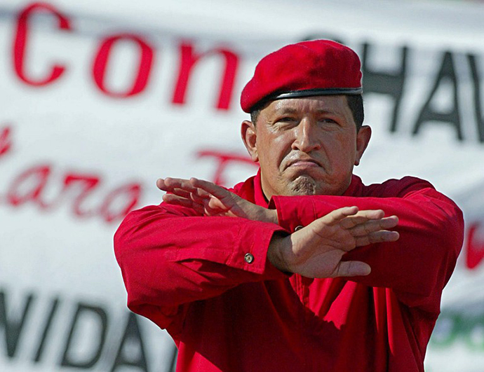 Venezuelan President Hugo Chavez gestures during a demonstration in Caracas 23 August 2003, celebrating his second three-year government (2000-2006). (AFP Photo / Juan Barreto)