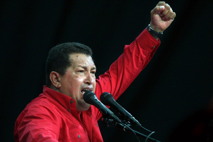 Venezuela's President Hugo Chavez raises his fist as he delivers a speech during a rally in Caracas on November 18, 2008. (AFP Photo / Thomas Coex)