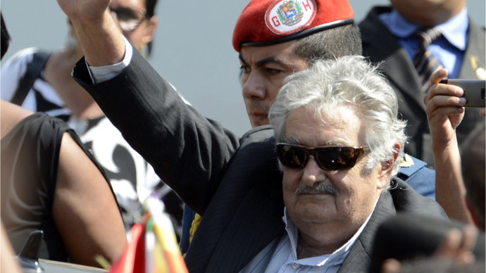Uruguay's President Jose Mujica waves during the funeral of Venezuela's President Hugo Chavez in Caracas, on March 8, 2013. (AFP Photo/Juan Barreto)