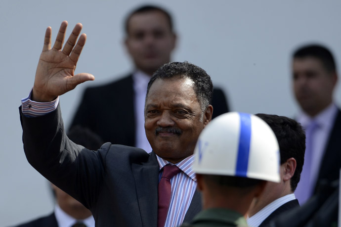 US Reverend Jesse Jackson waves as he arrives to pay his respects to deceased Venezuelan President Hugo Chavez, in Caracas, on March 8, 2013 (AFP Photo/Juan Barreto)
