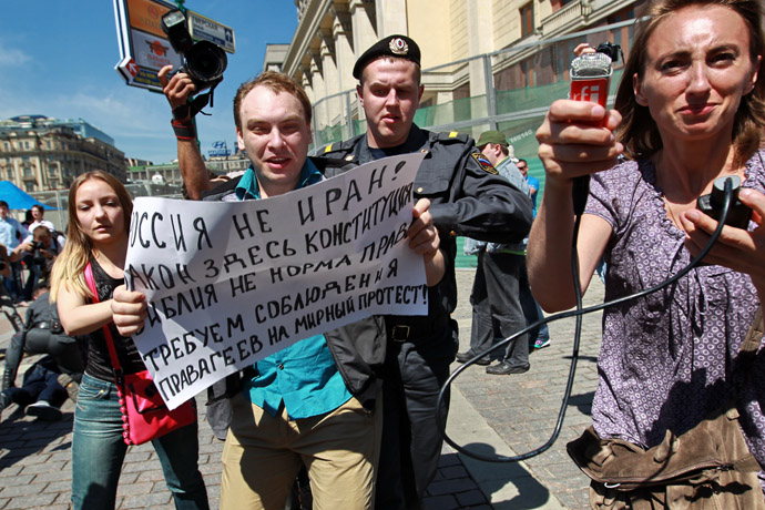 Police officers detain gay activists during the unauthorized Moscow Gay Pride 2011 rally. (RIA Novosti/Andrey Stenin)